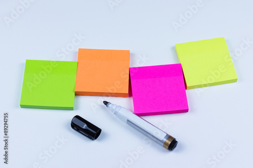 Arrangement of colored sticky notes with marker pen