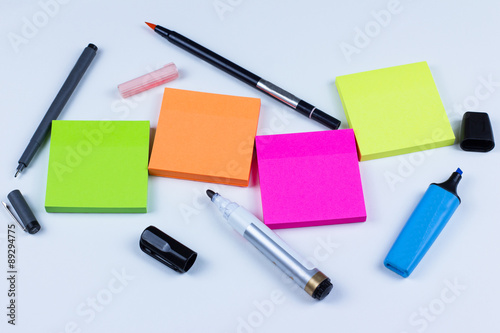 Colored sticky notes with pens and markers