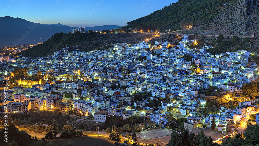 Evening view of Chefchaouen medina quarter with buildings painted in blue color from the hill of Jemaa Bouzafar Mosque, Morocco