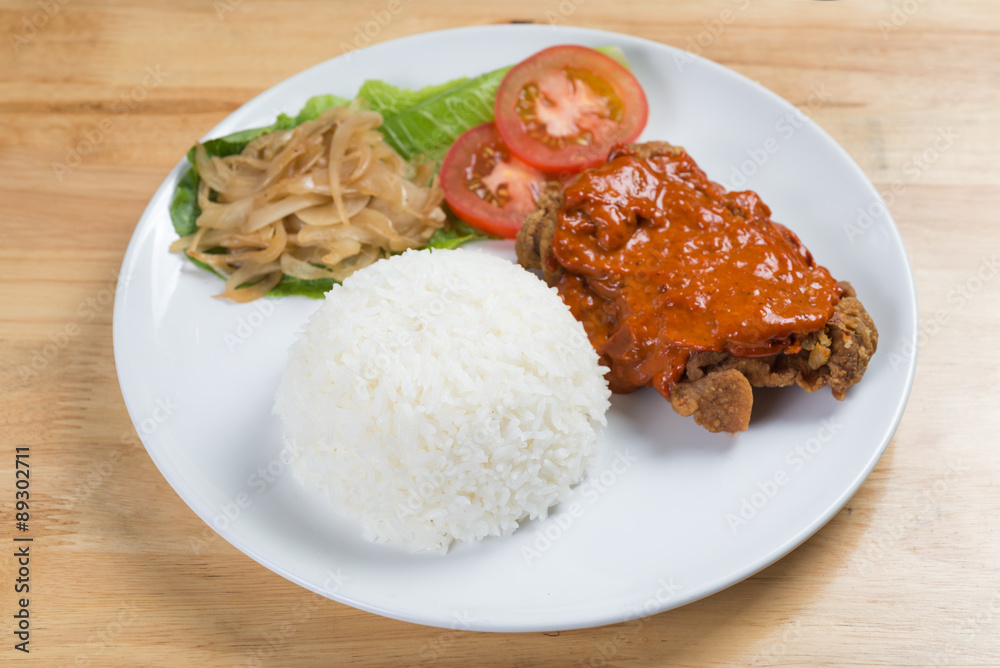 Steamed rice and fried chicken with red sauce Steamed rice and fried chicken with red sauce