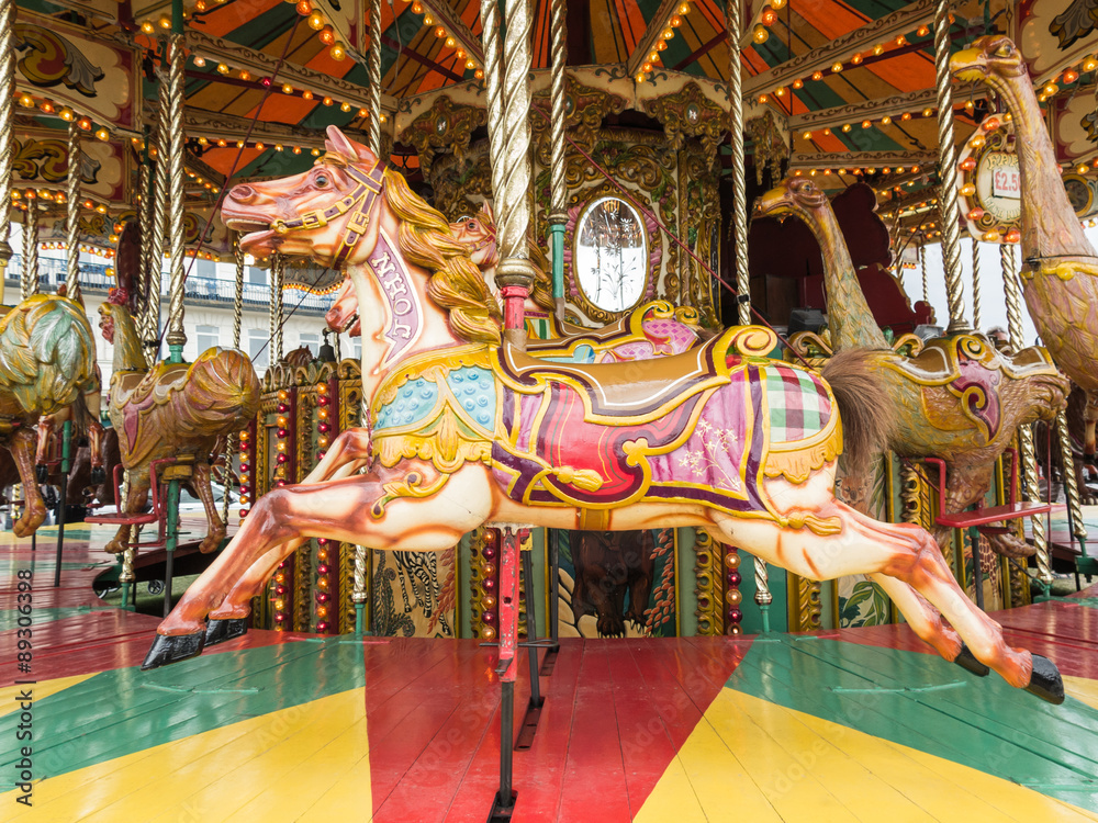 Horses on a traditional vintage carousel