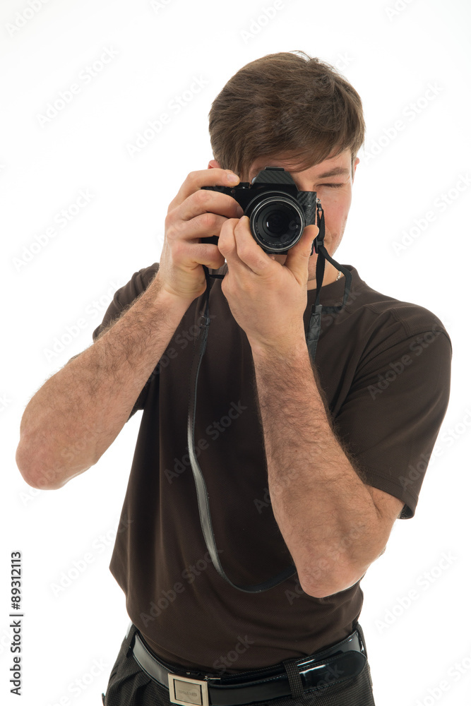 Young professional photographer shooting in the studio Young professional photographer shooting in the studio