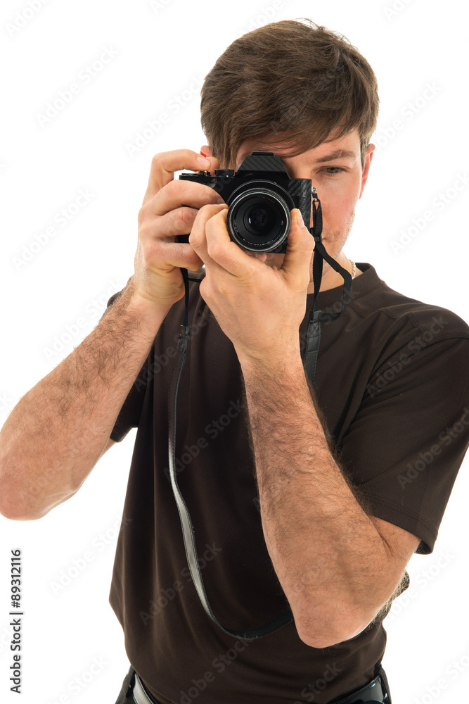 Young professional photographer shooting in the studio Young professional photographer shooting in the studio