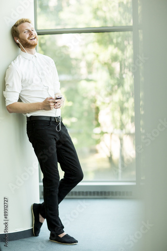 Young man with mobile phone...