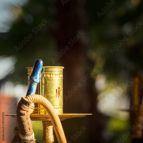 Part of hookah, traditional arabic waterpipe, in the arabic rest photo