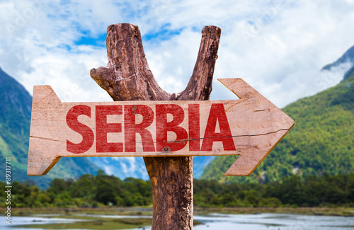 Serbia wooden sign with mountains background
