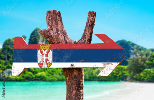 Serbia Flag wooden sign with river background photo