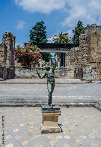 Statue in Pompeii city destroyed in 79BC by the eruption of Mount Vesuvius photo