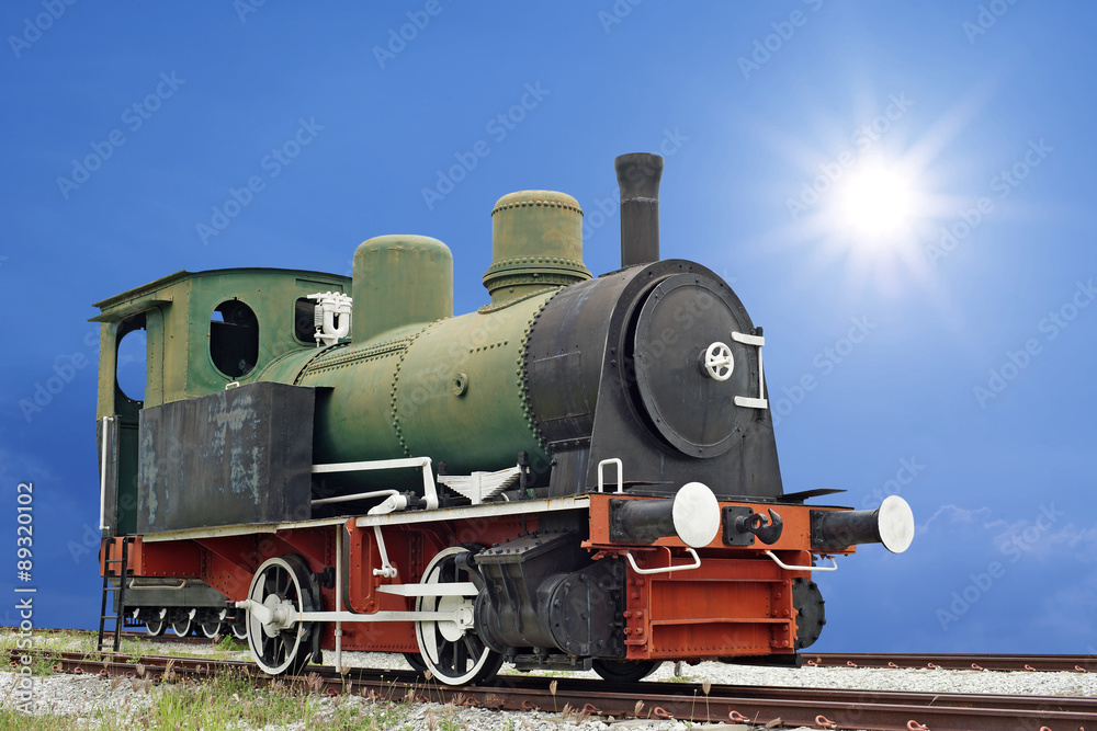 Fototapeta premium old steam engine locomotive train on beautiful sky background