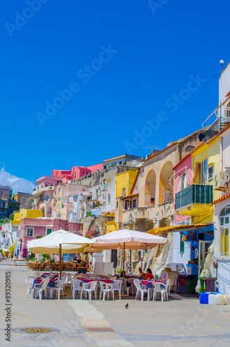 italian island procida is famous for its colorful marina, tiny narrow streets and many beaches which all together attract every year crowds of tourists coming from naples - napoli. photo