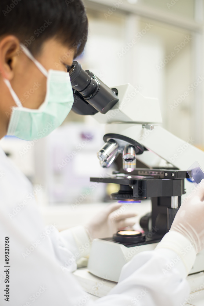 close-up of scientist using microscope. close-up of scientist using microscope.