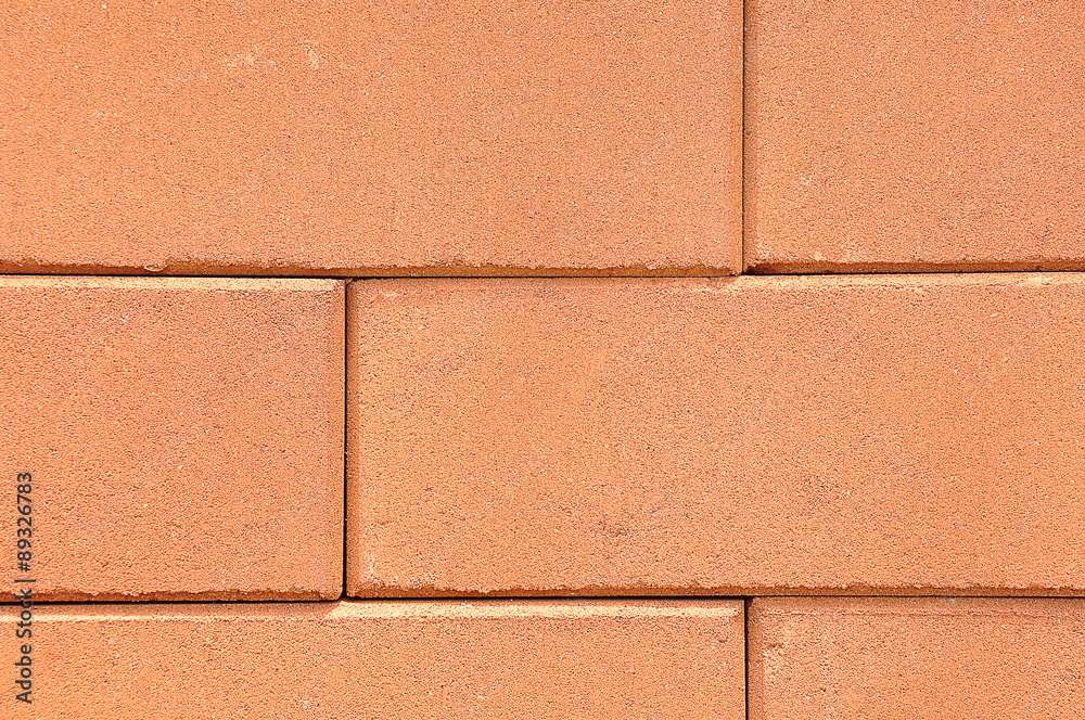 Fototapeta premium Lines of red clay bricks stack