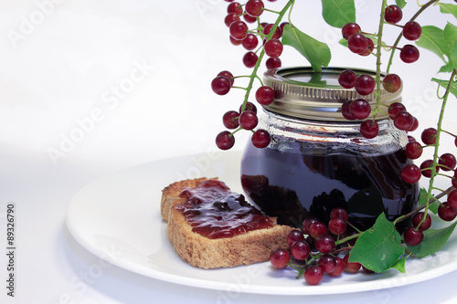 Chokecherry Jam Jar and Toast Under a chokecherry Branch. photo