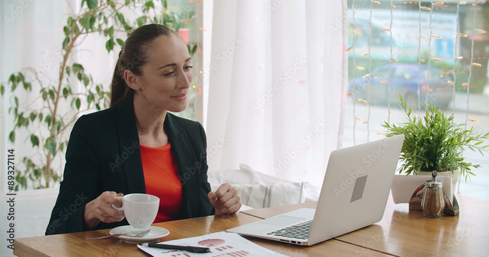 Pretty businesswoman receiving email message with good news Pretty businesswoman receiving email message with good news
