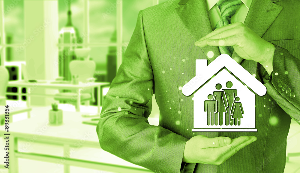 businessman protecting family in home with hands businessman protecting family in home with hands