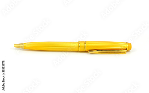 Golden pen on white background