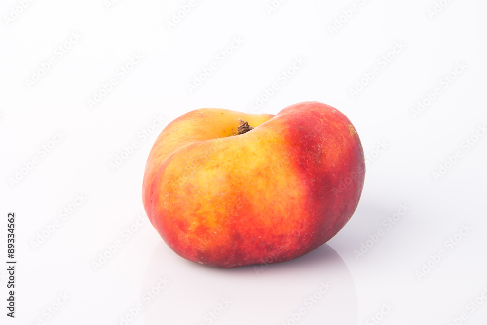 flat peaches (donut peaches) on a background