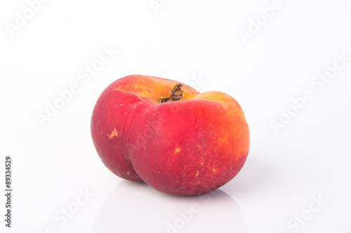 flat peaches (donut peaches) on a background