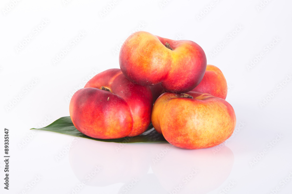 flat peaches (donut peaches) on a background flat peaches (donut peaches) on a background