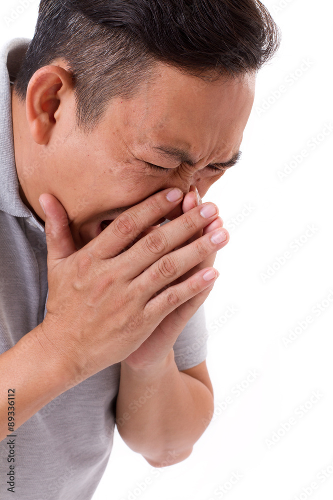 sick man sneezing