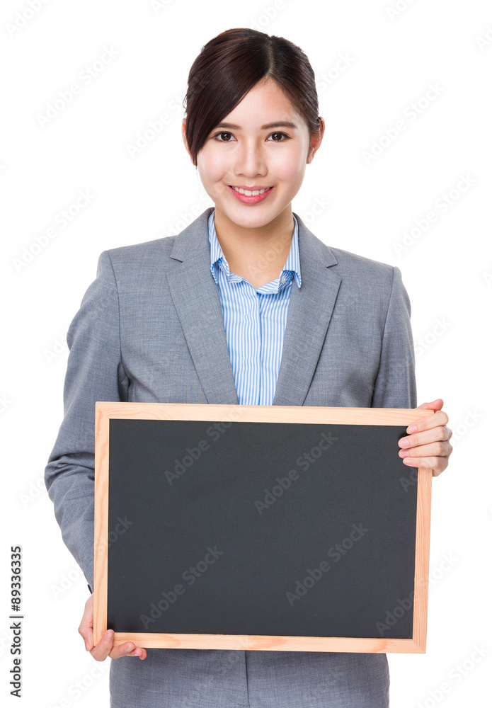 Asian young Businesswoman showing with empty chalkboard Asian young Businesswoman showing with empty chalkboard
