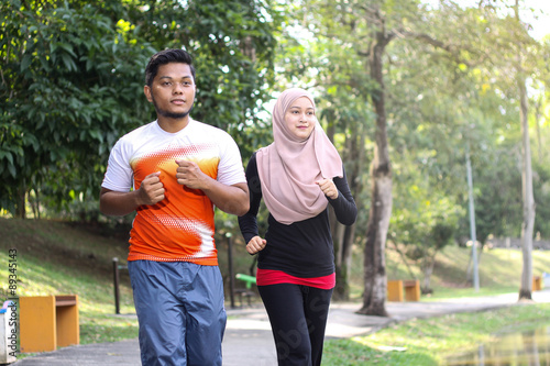 couple jogging in a park