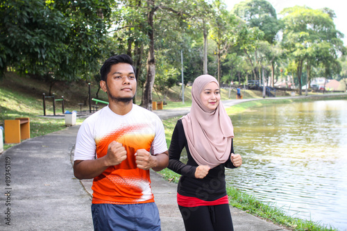 couple jogging in a park