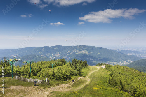 Fototapeta Naklejka Na Ścianę i Meble -  Mountain landscape from Skrzyczne. Hillside covered with pine tr