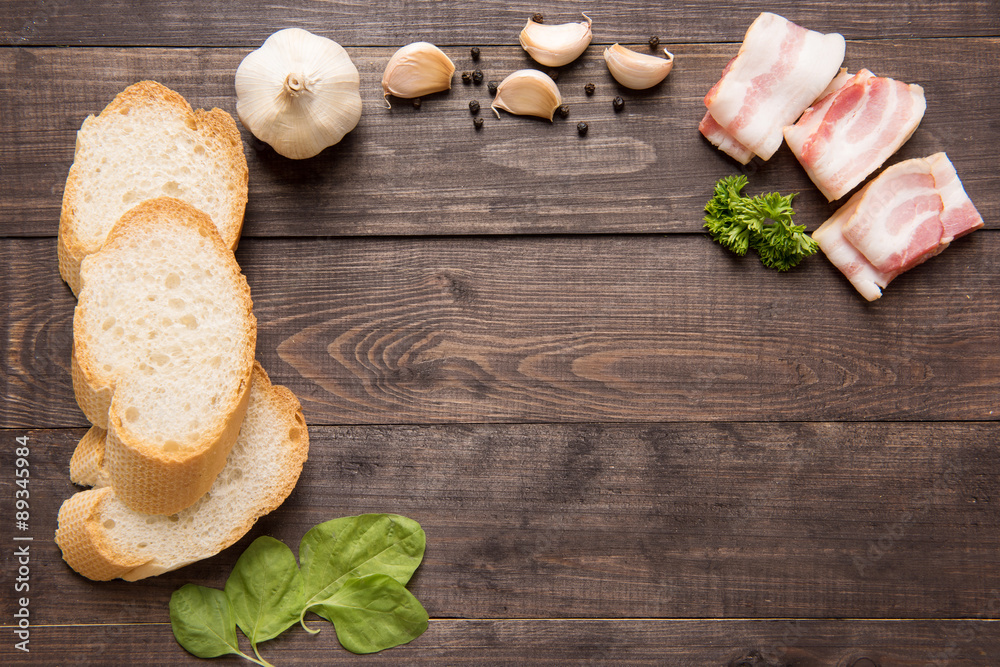 Ingredients for sandwich on wooden background