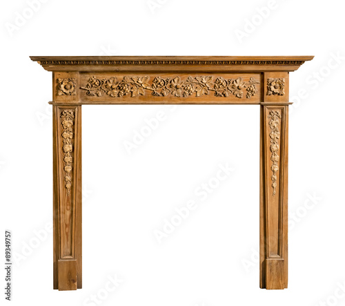 Antiqur pine fireplace surround with carving isolated on white t