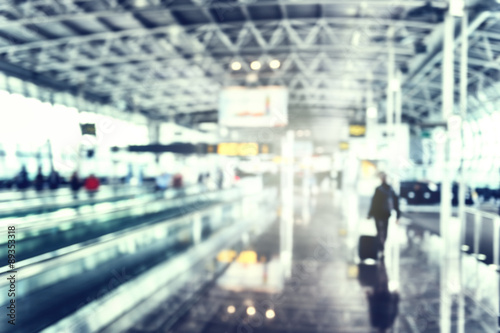 Blurred background of airport terminal in blue tone © Grecaud Paul