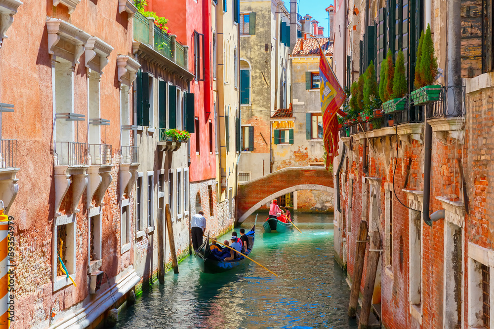 Gondolas on lateral narrow Canal in Venice, Italy