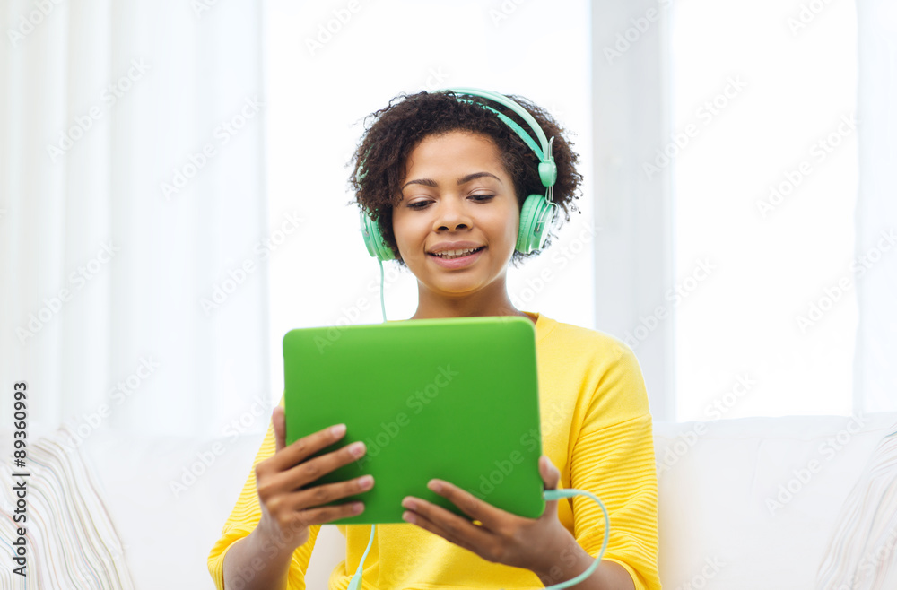 happy african woman with tablet pc and headphones happy african woman with tablet pc and headphones