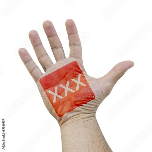 Red square XXX sign on a caucasian man hand photo