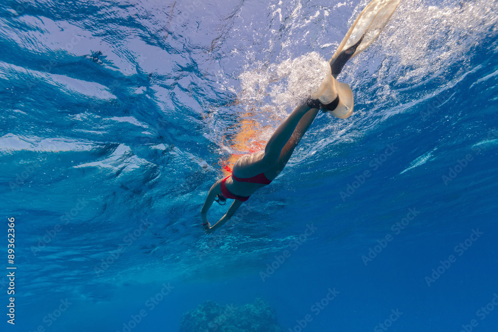Freediver snorkling on water surface