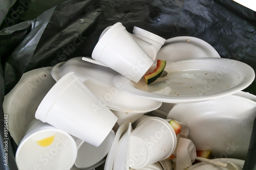 Photography Environmental unfriendly disposed styrofoam plates and cups in garbage bags