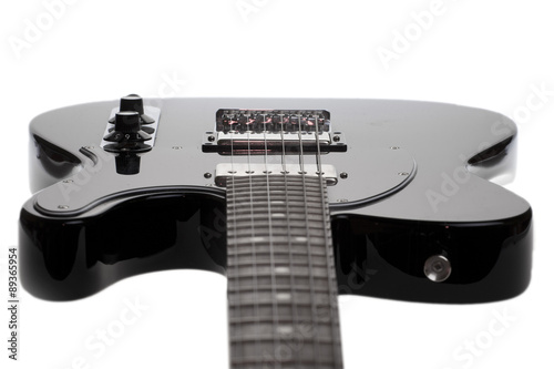 black electric guitar on a white background