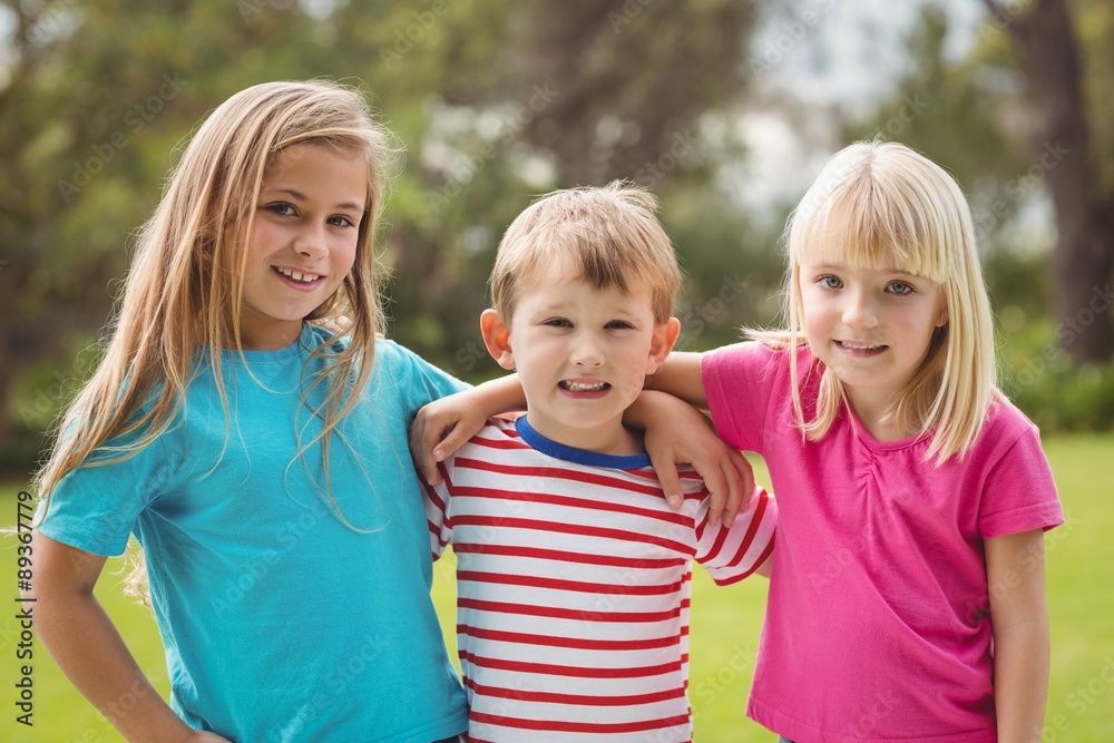 Fototapeta premium Smiling classmates with arms around each other