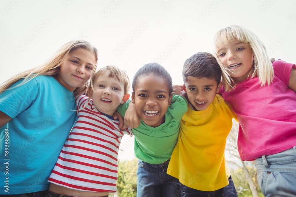 Smiling classmates with arms around each other Smiling classmates with arms around each other