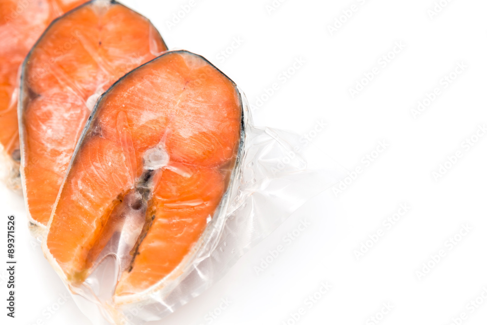 Frozen salmon fillets in a vacuum package Frozen salmon fillets in a vacuum package