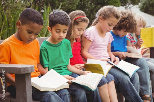 Children reading from books together