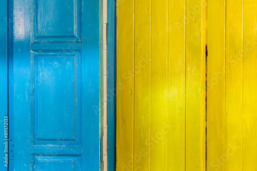 Colorful wooden door and window frames background © Wichit S