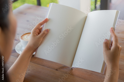 Hands open Blank catalog, magazines,book mock up on wood table w