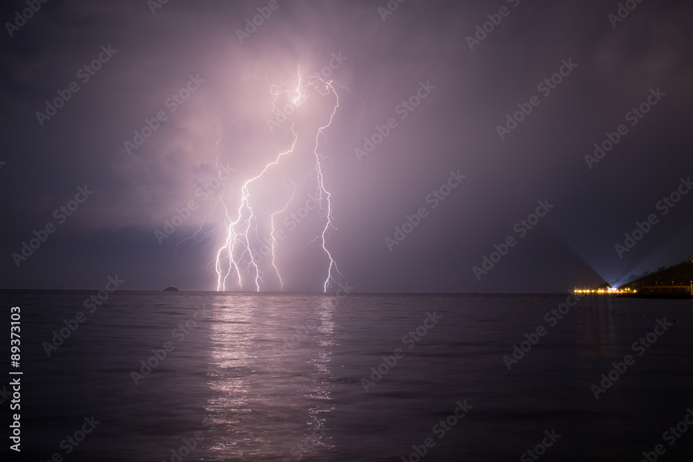 Spectacular lightnings striking the surface Aegean Sea