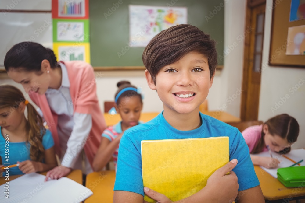 Pupil smiling at camera during class