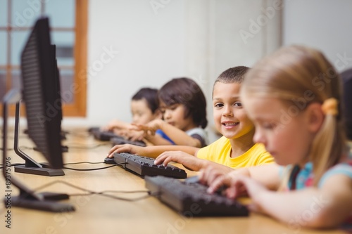 Cute pupils in computer class