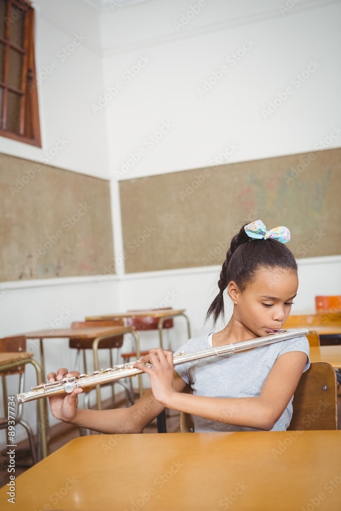 Student using a flute in class