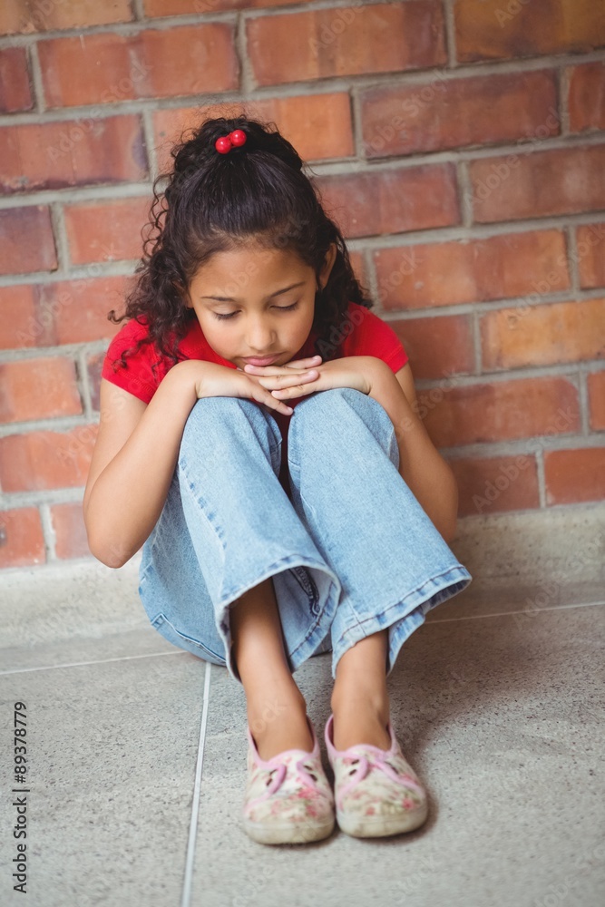 Upset lonely girl sitting by herself Upset lonely girl sitting by herself