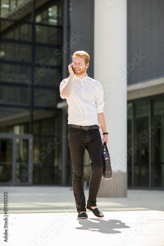 Young businessman with mobile phone