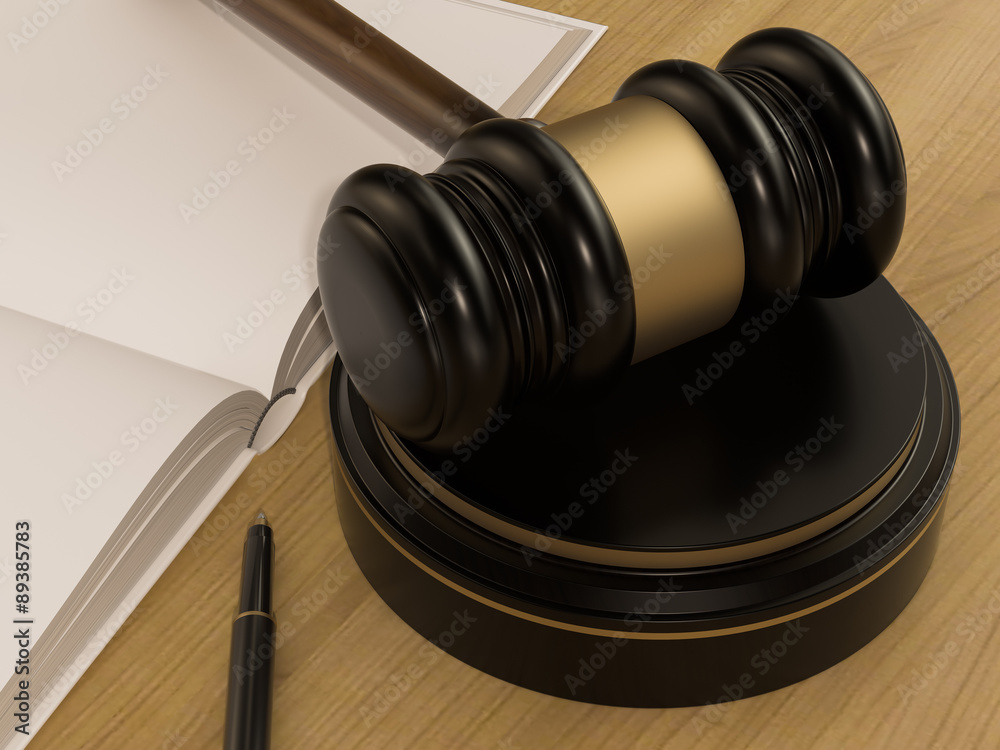 Wooden Judges Gavel And open book on the wooden background